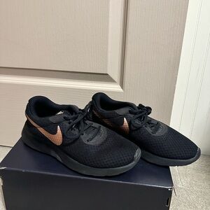 Nike Black Shoes with Bronze Swoosh